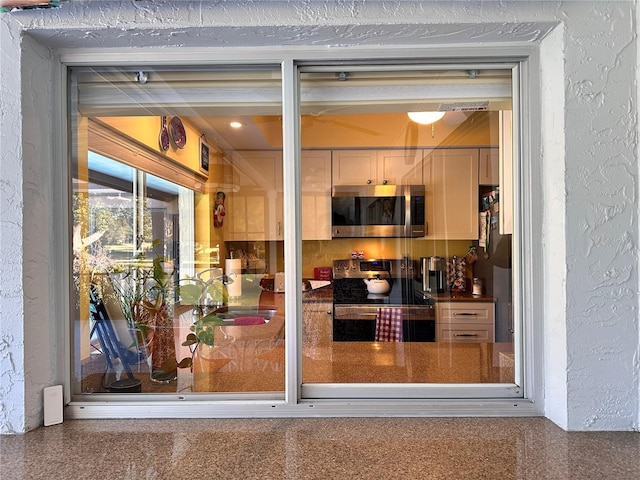 interior space featuring stainless steel appliances and sink