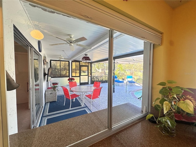 sunroom / solarium featuring vaulted ceiling and ceiling fan