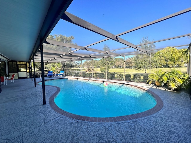 view of pool with a lanai and a patio area