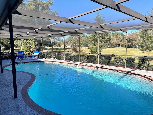 view of pool with a lanai and a patio