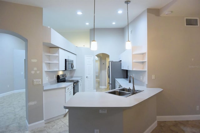 kitchen featuring pendant lighting, white cabinets, kitchen peninsula, and stainless steel appliances