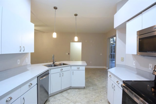 kitchen with kitchen peninsula, white cabinetry, hanging light fixtures, and appliances with stainless steel finishes