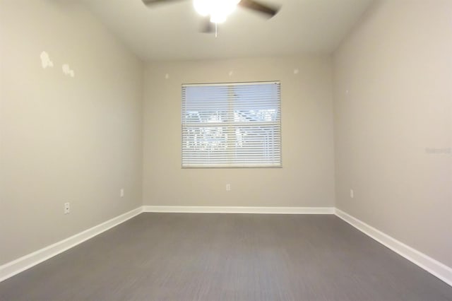 spare room with hardwood / wood-style floors and ceiling fan