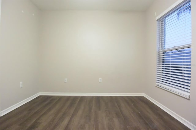 unfurnished room featuring dark hardwood / wood-style flooring