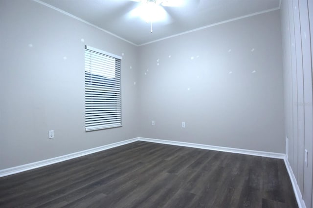 spare room featuring ceiling fan, crown molding, and dark wood-type flooring