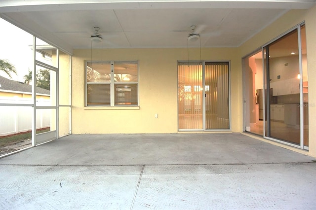 view of patio featuring ceiling fan