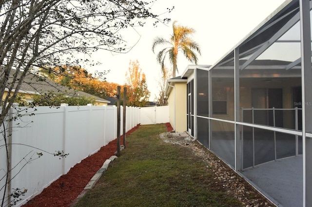 view of yard with a lanai