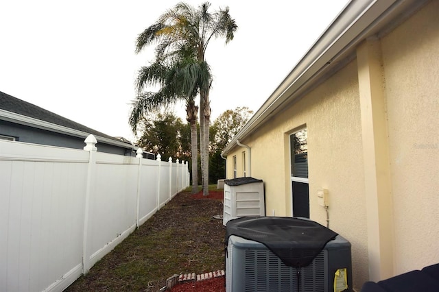 view of side of property featuring central AC unit