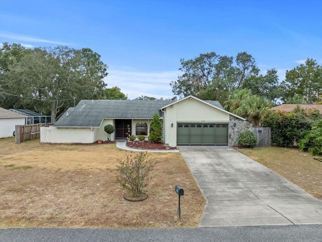 ranch-style home with a front yard and a garage