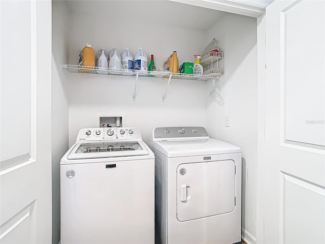 washroom with washer and clothes dryer