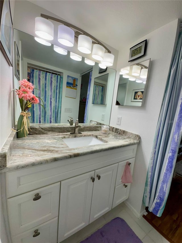 bathroom with vanity and tile patterned floors