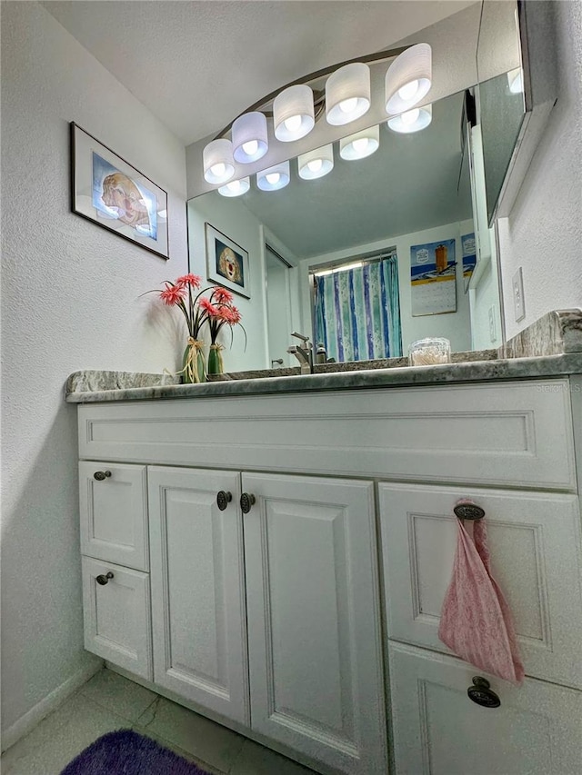 bathroom with vanity and tile patterned floors