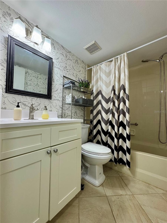 full bathroom featuring shower / tub combo, tile patterned floors, vanity, a textured ceiling, and toilet