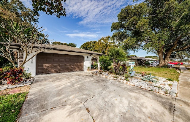 single story home with a garage