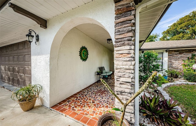 view of exterior entry featuring a garage