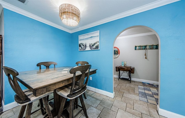 dining area featuring ornamental molding