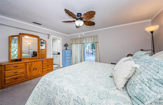 carpeted bedroom featuring connected bathroom, ceiling fan, a textured ceiling, and ornamental molding