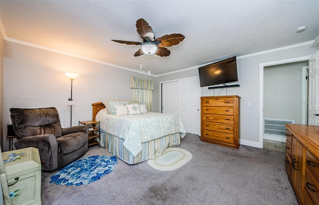 carpeted bedroom featuring ceiling fan, a closet, a textured ceiling, and ornamental molding