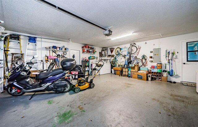 garage with electric panel and a garage door opener