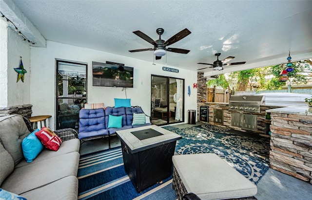 living room featuring a textured ceiling and concrete floors