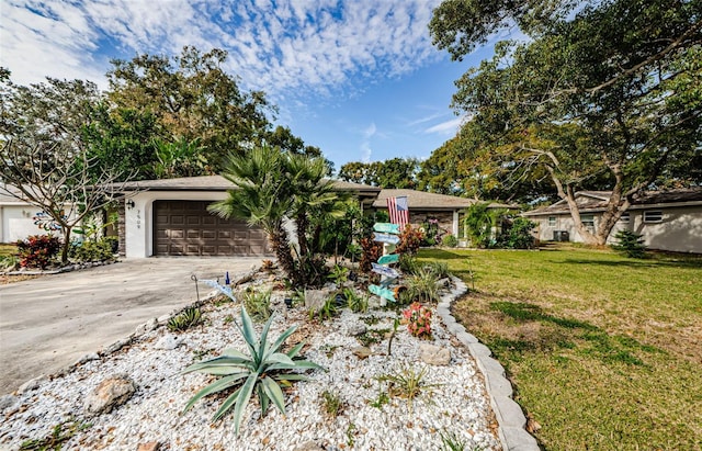 ranch-style home featuring a front yard and a garage