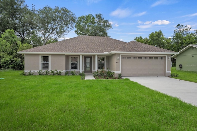 ranch-style home featuring a garage and a front yard