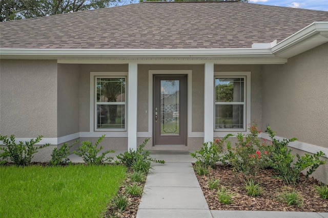 8249 N Creek Way, Citrus Springs, FL 34434 - property entrance featuring a shingled roof, stucco siding, and a porch