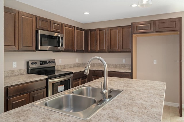 8249 N Creek Way, Citrus Springs, FL 34434 - kitchen with appliances with stainless steel finishes, dark brown cabinets, light countertops, and recessed lighting