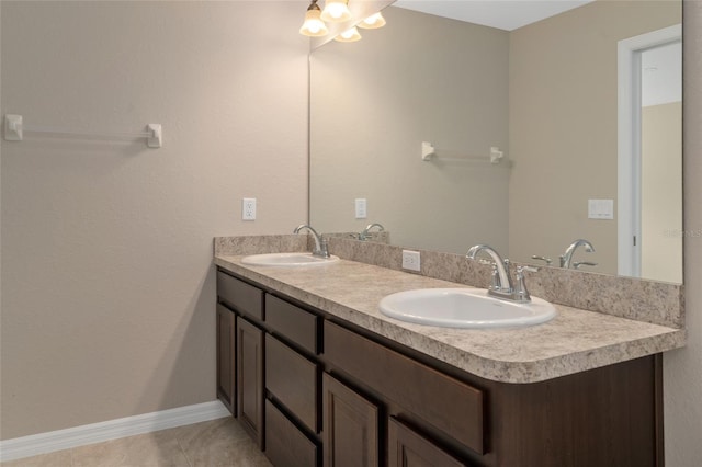 bathroom with tile patterned flooring and vanity