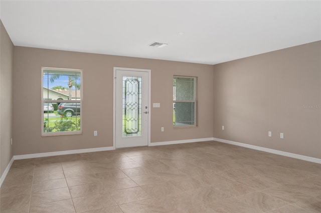 8249 N Creek Way, Citrus Springs, FL 34434 - empty room with light tile patterned flooring and baseboards