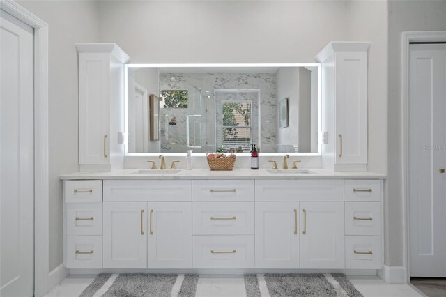 bathroom featuring vanity and an enclosed shower