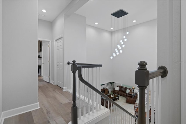 stairway with hardwood / wood-style floors