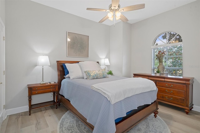 bedroom featuring light wood-type flooring and ceiling fan