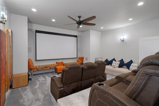 carpeted cinema room with ceiling fan