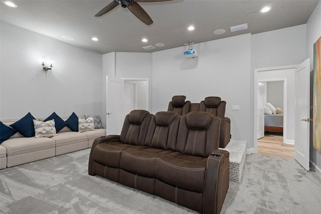 carpeted cinema featuring ceiling fan