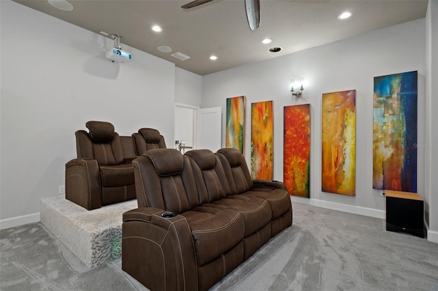 home theater with light colored carpet and ceiling fan