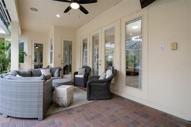 view of patio featuring an outdoor living space and ceiling fan