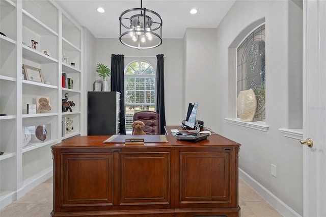 tiled home office featuring a chandelier