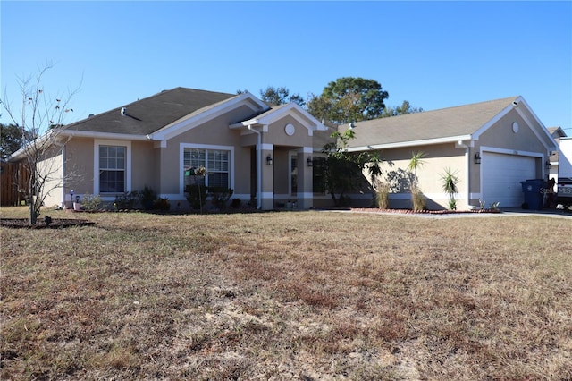 ranch-style home featuring a front yard and a garage