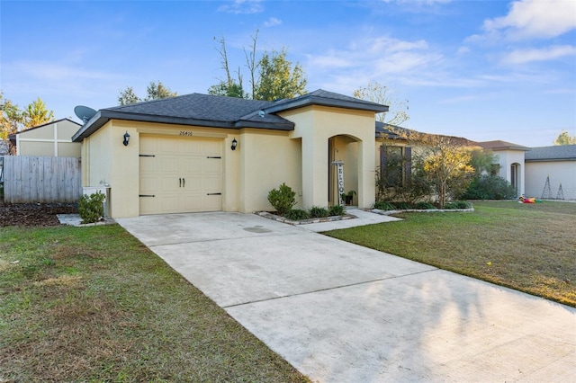 view of front facade featuring a front yard and a garage