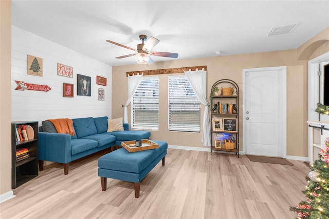 sitting room with ceiling fan and light hardwood / wood-style floors