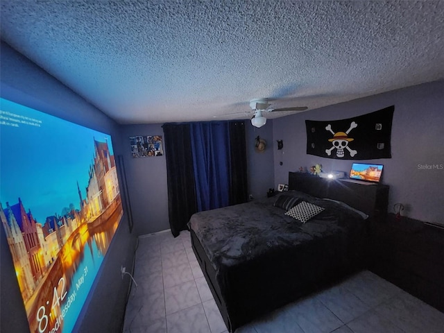 tiled bedroom with ceiling fan and a textured ceiling