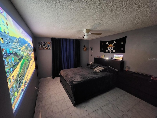 tiled bedroom featuring ceiling fan and a textured ceiling