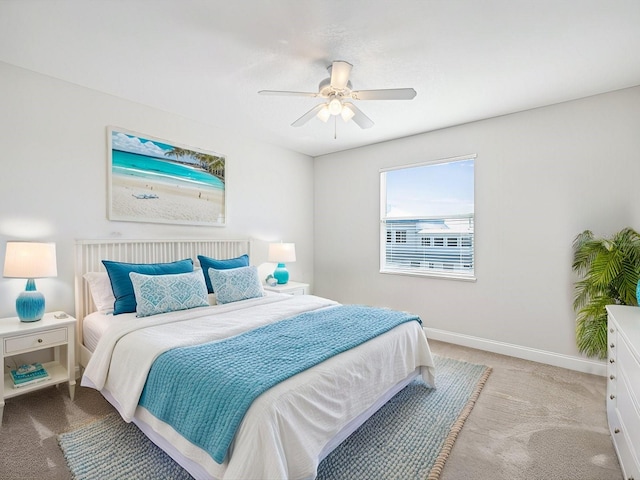 bedroom featuring ceiling fan and light colored carpet