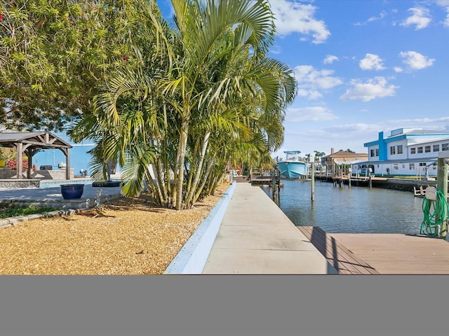 dock area featuring a gazebo and a water view