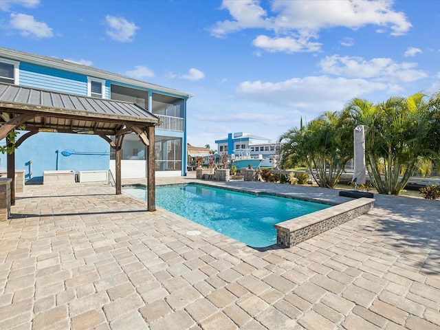 view of swimming pool featuring a patio