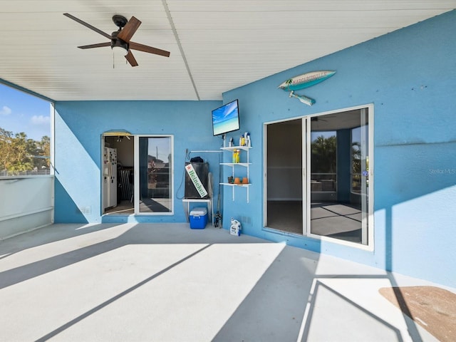 view of patio / terrace featuring ceiling fan