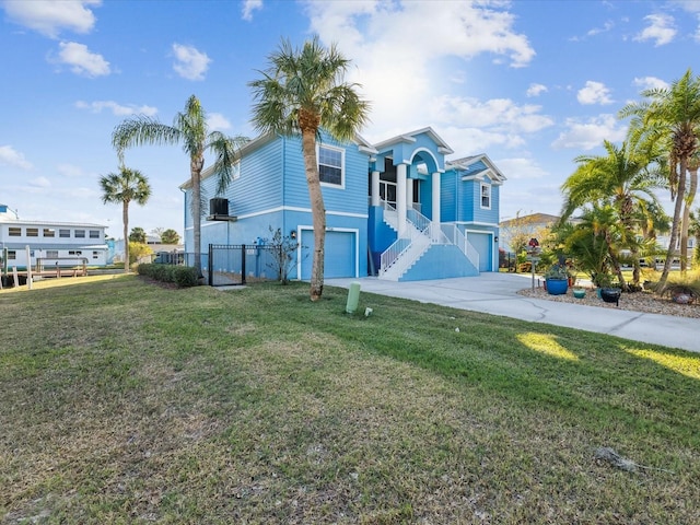 view of front facade featuring a garage and a front lawn