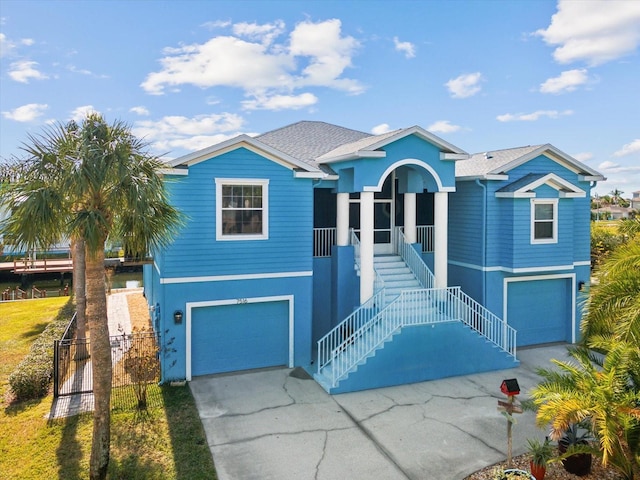 view of front of home featuring a porch and a garage