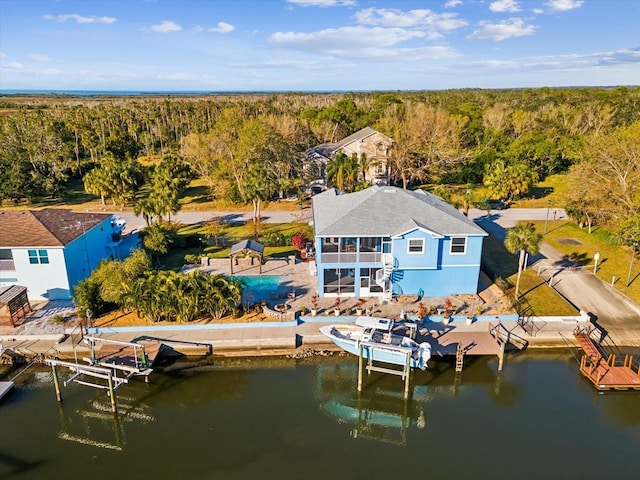 birds eye view of property featuring a water view